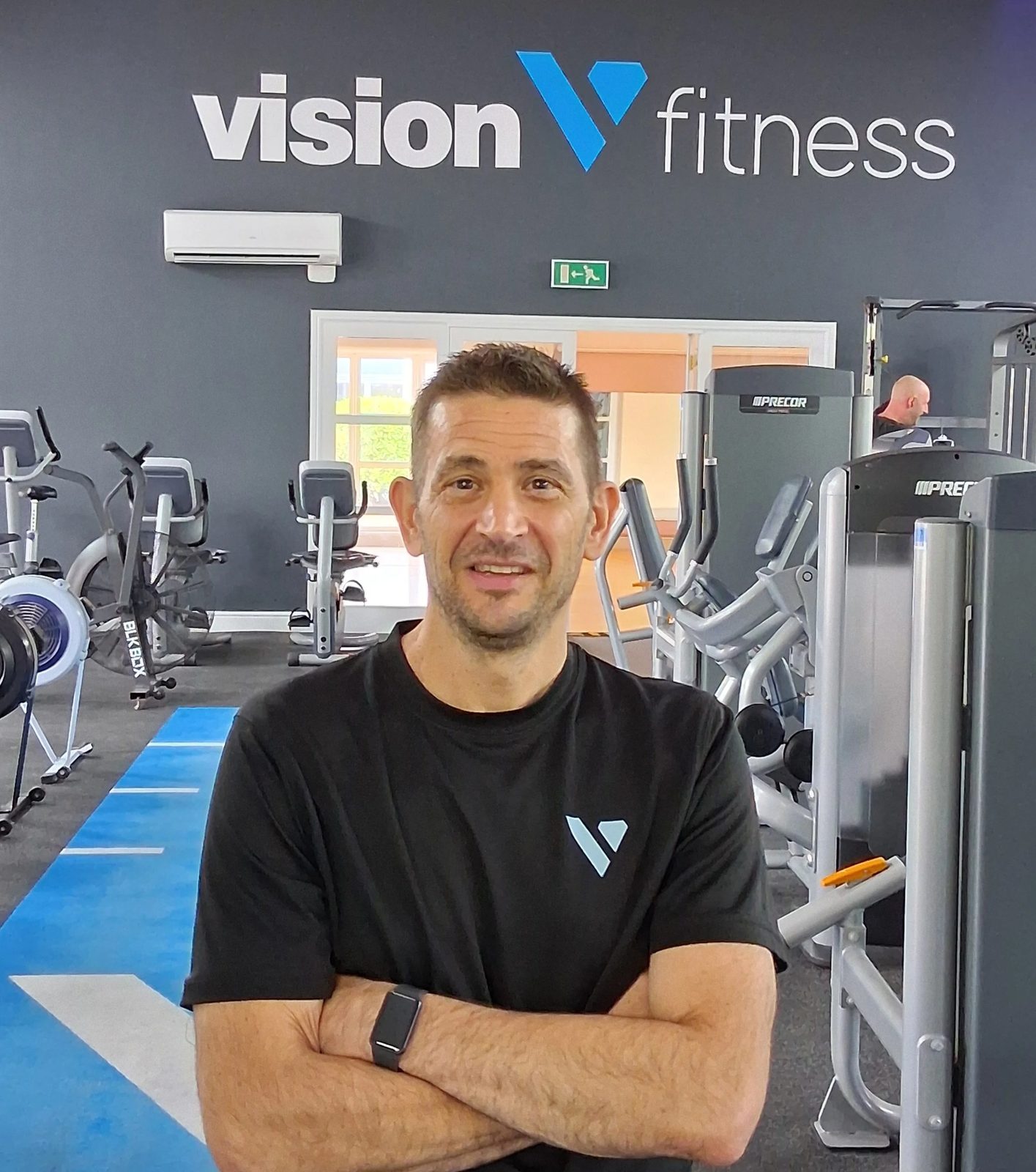 Vision Health coach on the gym floor